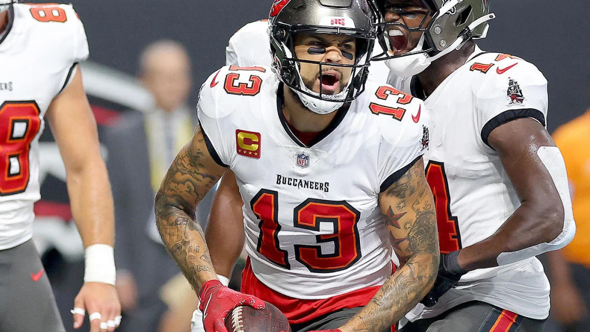 Fan Scores Big as Mike Evans Tosses Away Historic 100th Touchdown Ball